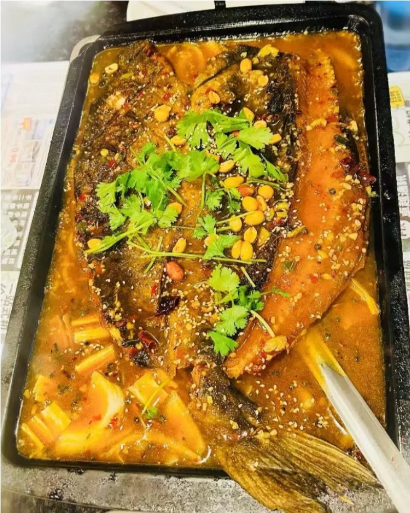 Soy sauce flavored grilled fish with cilantro and peanuts at Liu Roast Fish, an Chinese Restaurant in City of Industry
