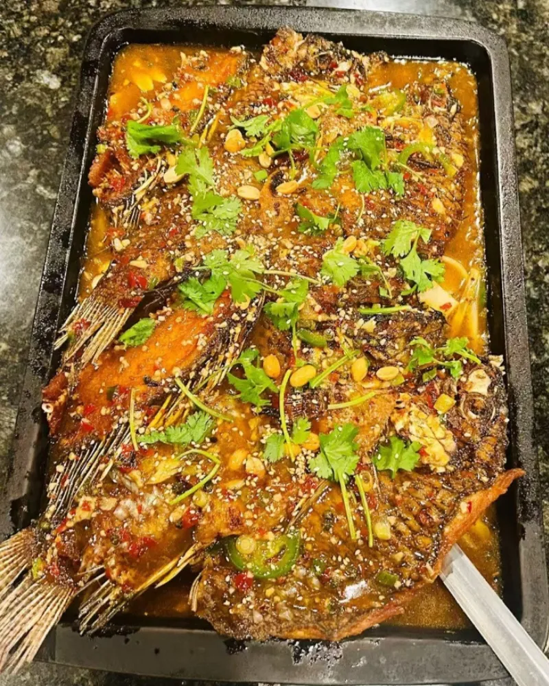 Two-flavor grilled fish platter with cilantro and sesame at Liu Roast Fish, an Chinese Restaurant in City of Industry